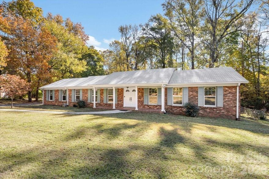 Welcome to 1840 Stoneyridge Drive, full brick level entry ranch home in Pine Island Country Club, 3-bedroom, 2-bathroom residence, 1,801 square feet, on a large lot .98 acres with Golf Course view from the front, complete privacy in the rear yard. 
Rocking Chair front porch with level entry, large foyer, living room, dining room, den, kitchen, New hardwood flooring, New windows, New blinds, HVAC 2023. The interior has been professionally painted, providing a fresh and inviting ambiance throughout.The home has been well cared for and move-in ready. The attached two car garage has great storage. See brochure for membership information for Pine Island. Don't miss this opportunity to make it yours! Take your golf cart down to the club to enjoy!!
