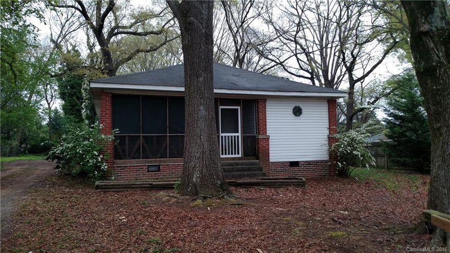 Updated a few years ago. Open floor plan with great room off the kitchen. Wonderful high ceilings and
original wood floors in all 3 bedrooms Master BR has private bath.  Screened front porch. Storage Building
.