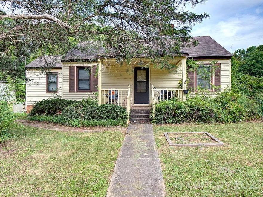 This charming cottage is nestled on a large 0.58-acre lot in a quiet neighborhood. It would make a great starter home or investment property! The front porch welcomes you home & is a great place for your rocking chairs. As you enter, you're greeted by a functional floor plan w/ a great flow for entertaining & everyday living. The home also includes attic storage space. You'll find 2 bedrooms, w/ the potential for a 3rd bedroom. The large backyard will be perfect for grilling out, entertaining, or watching the kids play. You'll also find a large shop, storage shed, & small utility building. Conveniently located just a short drive from shopping & dining. Come see your new home, today!