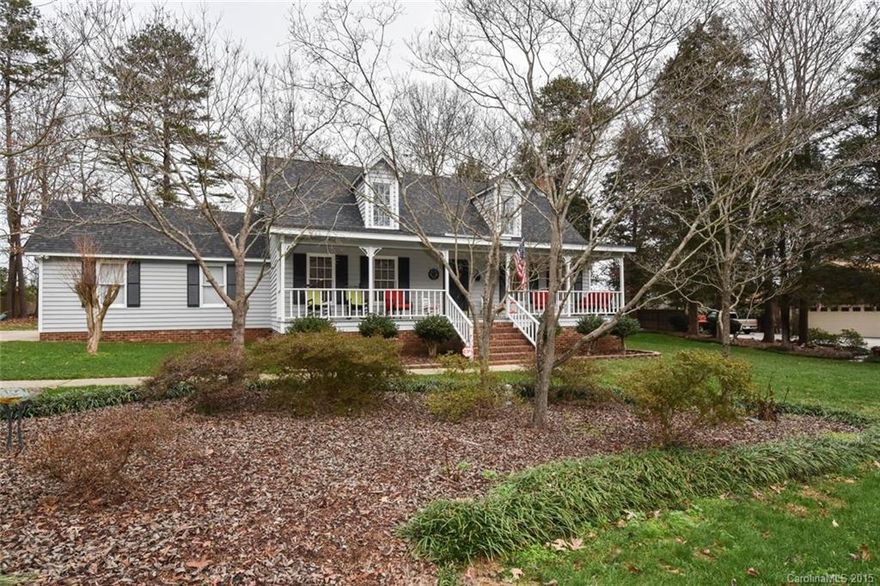 Wonderful home in a private but convenient setting. Minutes from I485, Biking Trail & UNC-C! Well maintained home w/ great curb appeal situated on a beautiful .47 acre lot. Wood floors in living area & Master Bedroom. Eat in kitchen opens to large deck & nicely landscaped back yard bordered by woods. Master bedroom on first floor. 2 Spacious secondary Bedrooms! Gas Fireplace in Den. Laundry Rm conveniently located off of the K. 1 car garage w/ lots of storage space. Rocking chair front porch!