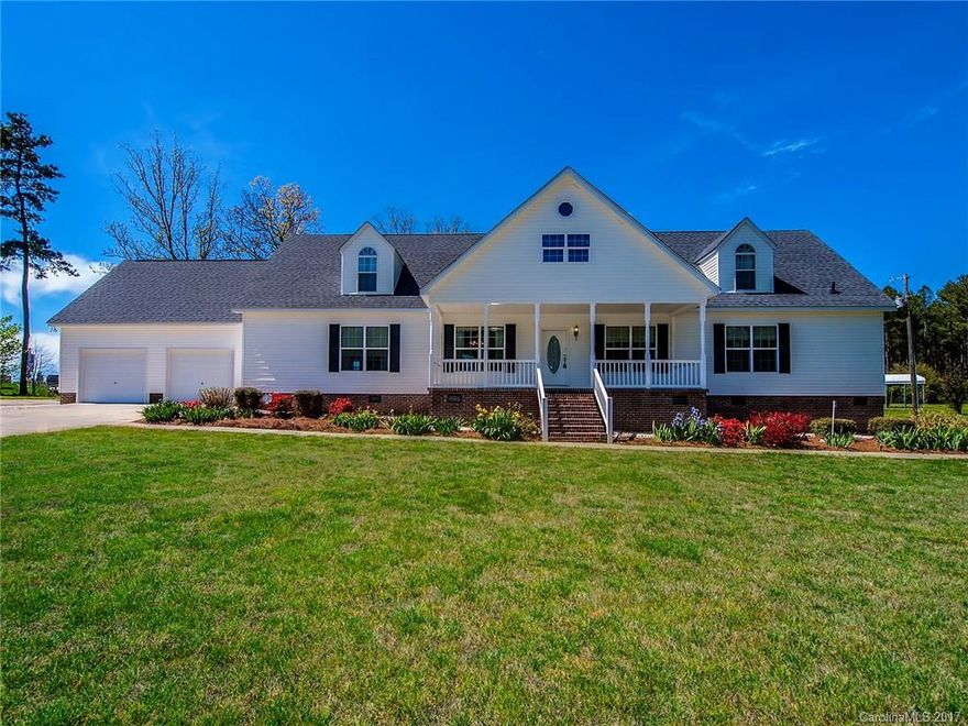 Beautifully maintained home in country setting on 3 acres. Upstairs has a separate living quarters that would be great for guests or family to live with their own separate kitchen.  For the car or workshop enthusiasts, there is a detached workshop/3 car garage space.  This space includes an office area that would be great for someone who works from home.  Property offers privacy and pretty landscaping, including fruit trees and an area great for a garden.