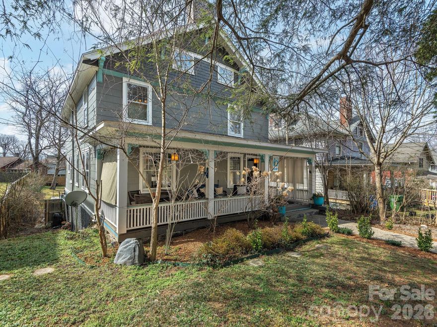 Own a piece of Asheville's history! This beautifully renovated Montford showpiece is in the heart of downtown and one minute's walk from renowned restaurants Tall John and Nine Mile. Easy stroll to Montford Park for tennis or Shakespeare in the Park; under one mile to downtown Asheville. Enjoy the welcoming front porch and historic charm of the spacious foyer. All the rooms are generously sized and there are four renovated bathrooms, all in the classic designer style of the era. Great for entertaining, especially with the updated chef's-style kitchen, two covered porches, a huge backyard with a firepit, and a place for dining al fresco on the concrete patio. The eat-in kitchen has abundant maple cabinetry and lovely quartz countertops. Second level has three very large bedrooms including the primary suite with its walk-in closet and large primary bath. The gorgeous guest/hall bathroom has marble floors and a huge soaking tub. Enjoy the gorgeous sunset view from the sunroom—perfect as an office, art or yoga studio, or sleeping area. Third floor is an awesome hangout room and bedroom that's just right for an office or guest area. In addition to the amazing main levels, there is a 500+ SF super-sweet studio/bonus area (not contiguous) with a separate entrance. It has a spacious bathroom with new clawfoot tub. Must see this lovely home to appreciate its class and charm. Amazing Montford location!