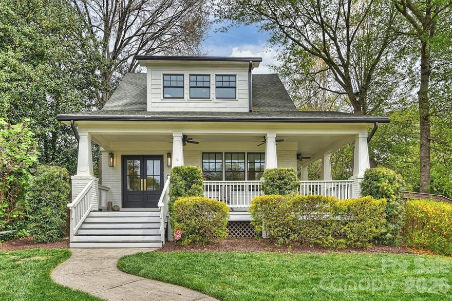 Step into timeless charm and modern sophistication at 2421 Kenmore Ave in the heart of Charlotte's sought-after Elizabeth neighborhood. This beautifully re-imagined bungalow was completely updated in 2020. This home effortlessly blends historic character with chic contemporary updates. From the moment you arrive, the gas lanterns lead you up to the wraparound front porch. Inside, blonde hardwood floors guide you through an open and airy layout. The living room, with its cozy Fireball gas fireplace, flows seamlessly into a chef-inspired kitchen with Viking refrigerator, pot filler & 5 burner gas stove and a cozy banquet dining area. The main level has a bedroom with a full bath, a half bath, and a laundry room featuring a sink. The back door has built-ins and a drop zone. Out back, your private outdoor oasis awaits. A covered travertine patio with retractable screens, built-in heaters, and dual TV sets sets the stage for year-round enjoyment, while a fire pit and turf yard create a perfect setting for relaxation or entertaining. The oversized one-car garage and gated, fenced yard add convenience and peace of mind. Upstairs, discover a versatile loft space—ideal for a home office, crafting, or lounging—alongside two charming bedrooms and a hall bath with dual vanities. The primary suite is a true retreat, with a spa-like bath with a soaking tub, a separate shower, and thoughtful touches throughout. Every inch of this home has been carefully selected to balance elegance and practicality. Don’t miss the chance to call this Elizabeth gem your own. Schedule your private tour today!