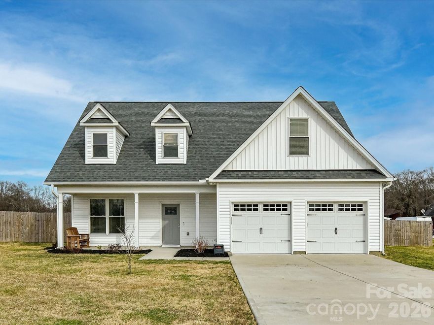 Are you looking for a like new home on over an acre with NO HOA literally only a couple minutes from the 74 ByPass with easy access back to Monroe/Matthews or Charlotte? This could be it! Bring reasonable offers! Sellers are motivated! Cozy front porch and large covered back porch extends the living space here for lots of entertaining, grilling and porch rocking. The huge back yard is wood fenced with privacy panels and so many possibilities for a pool, play set, gardening or building (no septic line to deal with!). The fence is just inside the property lines so even more space beyond to garden. Welcome inside this beautiful home to an open foyer/ floorplan and stairway overlooking greatroom. Primary bedroom on main level with beautiful primary bath including dual vanity, tiled walk-in shower, free standing tub, separate water closet and includes large walkin closet. Large Greatroom with grand ceilings and open to kitchen area. Kitchen offers an abundance of cabinets, granite tops, tiled back splash and stainless appliances.  Breakfast bar leads to Large dining area to accommodate a large table. Laundry Area on main level. Upstairs you will find a split bedroom plan with 2 bedrooms and a full bathroom. Extra Room up works perfect for bonus/play room or office space. A nice sized 2 car garage with storage room and longer paved driveway for more parking for guests. You will love the country living feeling with city amenities including water and sewer!! Come See and Fall in love with your new home!