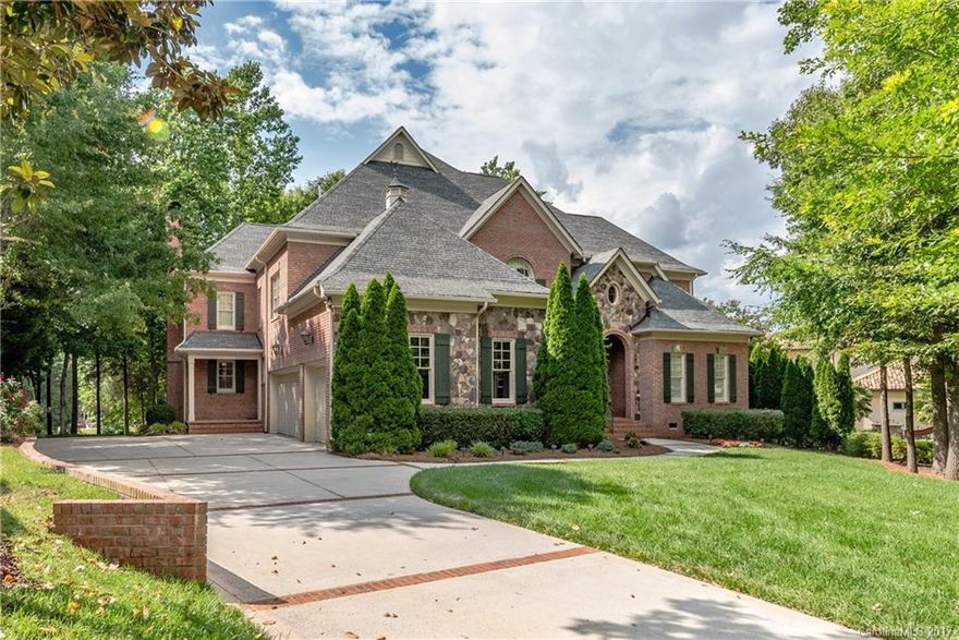 Lovely golf course and cul-de-sac location for this impressive brick/stone home built by Stan Howey. Enjoy views while entertaining on screened porch with FP, Viking grill, fridge, sink, food prep counter and more. Kitchen features SS Dacor appliances including built-in fridge, double ovens, warming drawer and gas range. All 5 bedrooms plus bonus and media room have new carpeting (2017). Lovely wide plank hardwoods, spacious drop zone and so much more make this an ideal place to call "home".