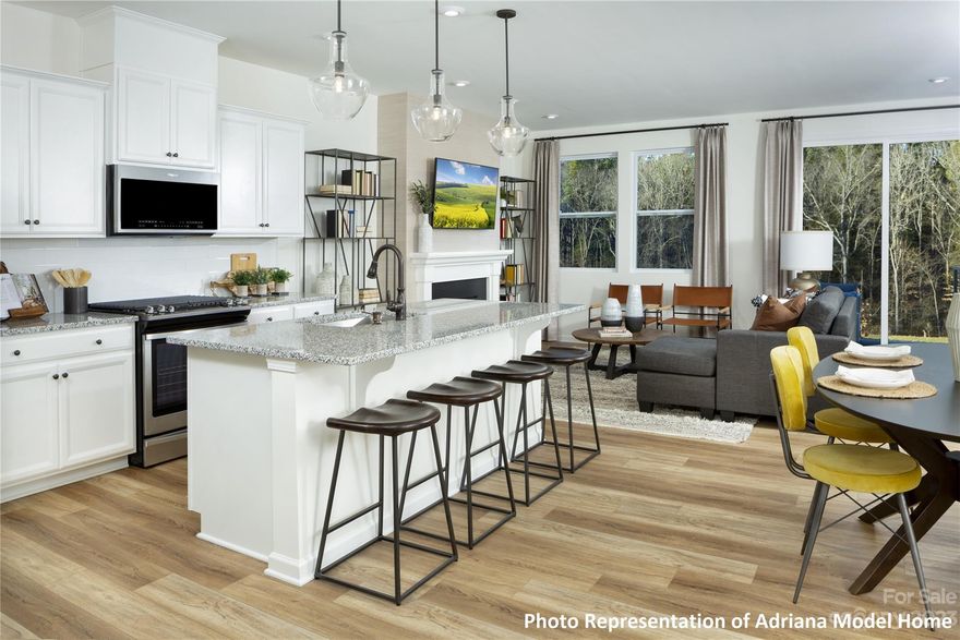 Brand New Townhome! Location...Location...Location! This popular Adriana floorplan has the living space privately tucked away in the back of the home. 3 beds plus loft, iron spindle stair railings, gorgeous kitchen, quartz kitchen and bathroom countertops.  Backs up to mature trees, located in the back of the community. Available for a February 2024 closing.