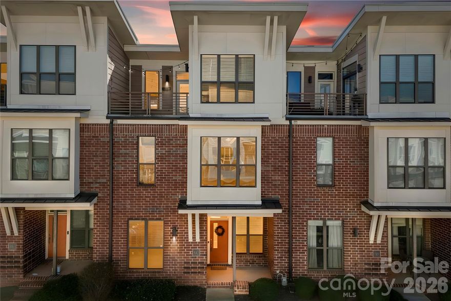 This beautifully maintained 3-story townhome in Steel Gardens offers stylish urban living with a private rooftop terrace in the heart of NoDa. Freshly painted throughout, the open-concept main living area features durable vinyl plank flooring, updated lighting, and abundant natural light. The kitchen is thoughtfully designed with a kitchen island, granite countertops, tile backsplash, stainless steel appliances, and ample cabinetry, flowing seamlessly into the dining area and spacious living room with a cozy gas fireplace. A convenient half bath completes the main level. Just off the living space, enjoy a private fenced outdoor area—perfect for grilling and relaxing.

The second level includes two generously sized bedrooms and a full bath with dual vanity, garden tub, and separate shower. The third-level primary suite is a true retreat, highlighted by soaring vaulted ceilings, expansive windows, and direct access to a stunning rooftop terrace ideal for entertaining or unwinding under the night sky and cafe lights.

Ideally located in NoDa, Charlotte’s historic arts and entertainment district, this home places you just blocks from eclectic dining, breweries, music venues, local shops, light rail access, North Charlotte Park, and convenient access to Uptown Charlotte.

Community amenities include a dog park, sidewalks, and street lighting. HOA dues cover water, sewer, Spectrum cable and internet, garbage service, and lawn and landscaping maintenance for easy, low-maintenance living. Move-in ready and positioned in one of Charlotte’s most dynamic neighborhoods!