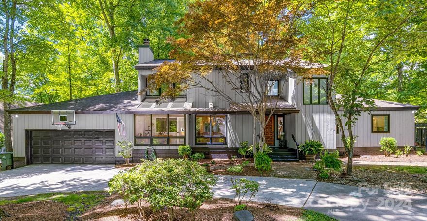 MULTIPLE OFFERS RECIEVED: highest & best due 6/12 by noon. Welcome to your new dream home within the prestigious, amenity-rich, 24-7 gated waterfront community of River Hills, served by award-winning Clover schools. This contemporary masterpiece features a fully remodeled home with sprawling hardwood floors throughout. From the kitchen to the primary bathroom, everything has been elegantly redesigned with luxurious fixtures, even including a new laundry room and custom closets. Natural light floods the high ceilings, highlighting the home's beauty and functionality, with the primary suite on the main level. Another room on the main level is functional for an office, flex, or bedroom. Perfect for entertaining, this home offers multiple living areas, including a brand-new back deck with an additional covered & screened porch. The large, shaded backyard is fenced for privacy and designed for low maintenance. Enjoy peace of mind with brand-new HVAC, all-new ductwork, and new crawlspace