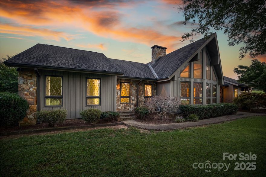 STUNNING, GORGEOUS custom built, one owner home w/3+ acres!! Living room w/such WOW factor…featuring floor-to-ceiling stone FP (& windows), vaulted beamed ceiling & wormy chestnut walls! Spacious eat-in kitchen w/an abundance of custom cabinets, large laundry room & oversized primary suite w/his & hers walk-in closets…all on the main level. In addition, the main level offers a spacious separate living area w/interior & exterior entrances, den, dining area, kitchenette, 2 bedrooms & full bath!! For additional storage needs there is an abundance of storage between the walk-up attic & unfinished basement. The front circle driveway wraps around back to a detached double garage w/a walk-out door, large home office, 1/2 bath & utility sink! Double parking in rear of home on main level. Nice level yard & convenient location! This home is a true gem w/TONS of potential! Ready for you to update to your liking! Picturesque setting!! Just 15 mins to Morganton/20 mins to I-40/25 mins to Hickory!