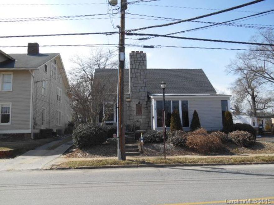Great business exposure on Tradd St. in Statesville. Formally a Kitchen/bath remodeling & interior design showroom and a hair salon/spa. Has cellar basement. Close to Hwy 64 & 21.