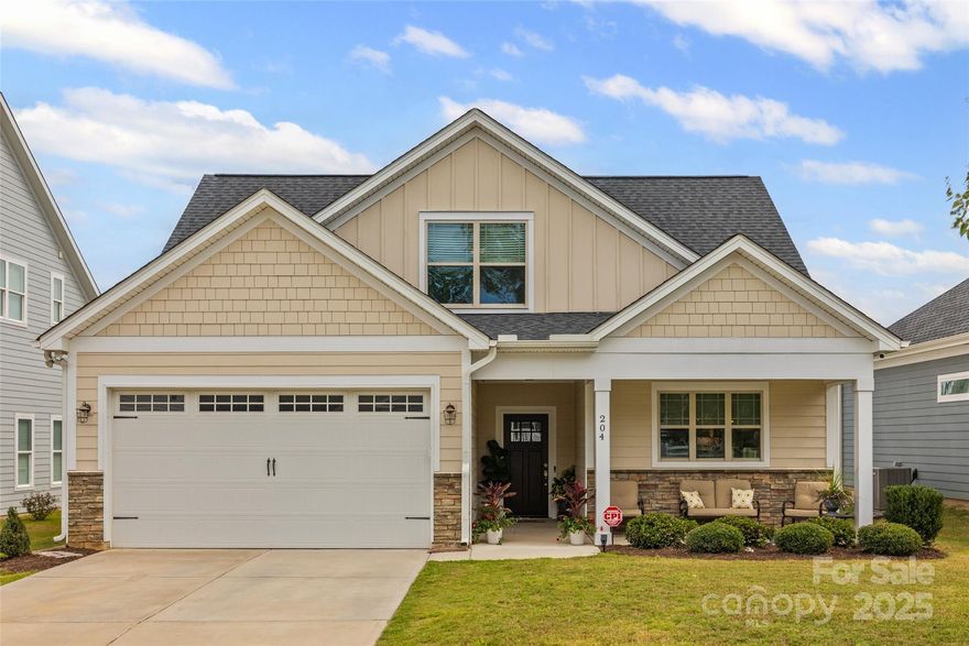 Searching for a cozy community where you can enjoy coffee on your front porch, evenings on your back patio, & a low maintenance backyard? This two-story gem in the Villages at Cramerton Mills is calling you home! Enjoy having your spacious PRIMARY BEDROOM ON THE MAIN level with outfitted walk-in closet, & an en-suite bath with dual sinks & walk-in shower. The living room features a beautiful coffered ceiling, gas log fireplace, & flows seamlessly into the dining area. Your dream gourmet kitchen awaits with soft close & white cabinetry, ample storage & counter space, & stainless steel appliances - including a gas range! Rounding out the first level is a half bath for guests & a dedicated laundry room. Head upstairs to find two full bathrooms w/ beautifully tiled tub/shower walls and four additional bedrooms - providing plenty of  opportunity for a dedicated office or bonus space! With Cramer Mountain Club just around the corner and local downtown favorites like Goat Island Park, Mayworth's, & Floyd & Blackie's less than 3 miles away - small town meets comfort & convenience here in Cramerton! If you live life on the road or simply love to explore, don't forget Belmont, Lake Wylie, & Charlotte are all still a quick commute too! This just might be THE ONE!