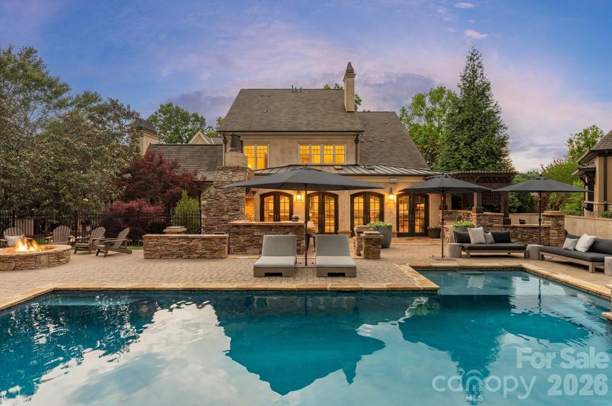 Nestled on a quiet cul-de-sac in the prestigious gated community of Skyecroft, this exceptional custom Simonini luxury estate sits on a private 0.65-acre homesite and offers refined design, elevated craftsmanship, and resort-style outdoor living in one of the area’s most sought-after neighborhoods with top-rated schools and close proximity to premier dining and shopping. Residents enjoy outstanding community amenities including tennis courts, clubhouse, walking trails, and playground.

Beautifully updated with sophisticated designer finishes throughout, this home showcases timeless elegance blended with modern functionality. A dramatic curved staircase, extensive custom trimwork, exquisite chandeliers, and three fireplaces create an unforgettable first impression.

Designed for both everyday living and entertaining, the chef’s kitchen is a true showpiece featuring a large six-burner cooktop with griddle, double ovens & dishwashers, built-in coffee machine, culinary workstation sink with dual faucets, center island, and an exceptional scullery complete with additional sink and prep space. The kitchen flows seamlessly into the breakfast area, spacious living room, and inviting keeping room.

The stunning sunroom feels like a private European retreat with arched doorways, fireplace, grilling area, and panoramic views of the backyard oasis. The main level also features an elegant dining room, private office, and luxurious primary suite with direct sunroom access, a boutique-style custom closet, and spa-inspired bath showcasing floor-to-ceiling tile, soaking tub, and separate vanities.

The upper level offers four additional ensuite bedrooms along with a media/bonus room and an additional flex space ideal for a gym, playroom, or second office.

Outdoor living rivals a private resort with multiple tiered entertaining spaces surrounding the spectacular pool and hot tub. Enjoy the outdoor kitchen with bar seating, pergola lounge with wood-burning fireplace, expansive firepit area all beautifully curated and designed for year-round enjoyment and privacy.

This extraordinary property delivers the ultimate luxury lifestyle and truly feels like a private staycation destination every day.