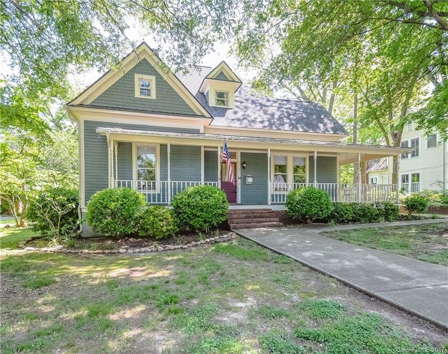 Charming Victorian home in the heart of Mooresville sets on a large lot with room to roam! Wrap-around covered porch with swing invites you to relax. This home preserves the historic feel, yet updates to bathrooms and kitchen allow for today's lifestyle. Large rear yard comes to life with blooms in the spring with a "meadow" feel and still preserves space to play. Located on a quiet street and walking distance to the heart of Mooresville's shopping and entertainment.