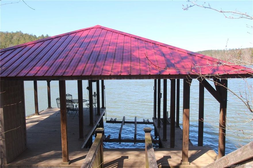 WATERFRONT lot with fantastic DOCK already in place. Gated community with city water and city sewer.   This lot is already cleared and ready for your dream home.  Building site has beautiful lake views. Enjoy the peace and quiet of Lake Rhodhiss.  Lake Rhodhiss is ideal for fishing, boating, water skiing, wakeboarding, paddle boarding, swimming, kayaking, canoeing; all water activities! Community recreation area nearby. Underground utilities.