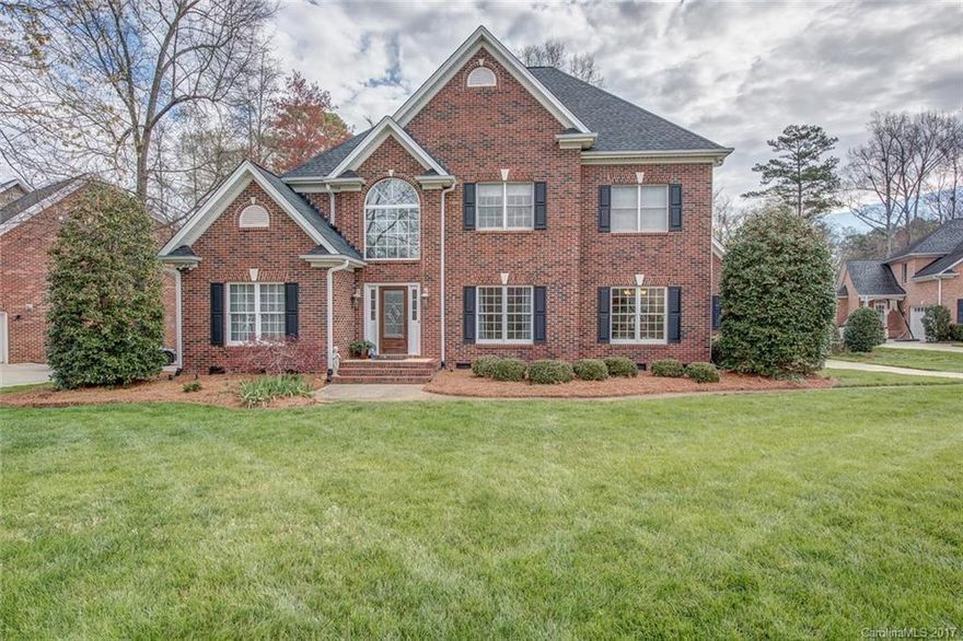 Beautiful custom built brick home in gated Cramer Mountain.  Curb appeal is wonderful, level lot, situated at the mouth of the cul-de-sac, w side load garage, and private backyard.  Kitchen open to great room so you can enjoy the fireplace and stay connected when entertaining!  Master on the main level with spacious separate closets and large bath.  Office has built-in bookcases and bead board backing.  All secondary bedrooms are large and most have walk in closets. Upstairs also has living area