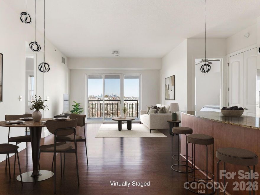 Imagine walking into your home at the end of a long day to see the lights of Uptown twinkling in the distance as you enjoy a spectacular sunset from your covered balcony on the peaceful north side of Piedmont Row. This well-appointed split 2 bedroom condo has great storage: laundry room, coat closet, pantry closet, walk-in closets in the bedrooms PLUS a separate storage unit in the building. Kitchen includes granite counters with fabulous cabinet space & under-cabinet lights. Unit has new carpet and neutral fresh paint. Condo has 2 assigned same-level parking spaces in gated owners' area near the elevator. Piedmont Town Center includes on-site restaurants (Peppervine, Bentley's, Duckworth's, Del Frisco's, Leo's, Mal Pan, Tous Les Jours Bakery, Summit Coffee), dry cleaner, fitness club and personal care venues (hair, lashes, day spa). Living is easy at Piedmont Row!