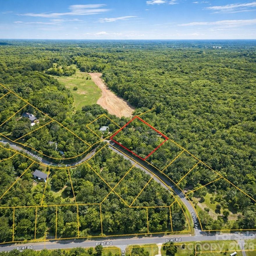 NEARLY 1 ACRE WOODED LOT IN CHARLOTTE WITH ROAD FRONTAGE NO HOA PRIVATE SETTING
 
Discover a rare opportunity to own nearly 1 acre in an established neighborhood in Charlotte. Located at 8930 Colson Ave, this 0.9-acre wooded lot offers a private setting with approximately 229 feet of road frontage and flat topography, making it an ideal location for a custom home.

This property consists of two original lots (Lots 54 & 55 of Mint Hill Estates) combined into one parcel, providing added flexibility in layout and design. The lot is wooded, offering natural privacy and a peaceful setting while still being conveniently located near city amenities.
 
Zoned residential with no HOA, this property allows for a single-family home and typical residential accessory structures. There are deed restrictions in place requiring residential use only and limiting the property to one single-family dwelling, helping preserve the character of the neighborhood.
 
No public water is available, and the property will require a private well and engineered septic system. A prior septic permit denial from 2008 is available, indicating that a modern engineered septic system will be required for development. Buyers are encouraged to conduct their own soil and site evaluations.
 
The property is not located in a flood zone and contains no mapped wetlands, offering a cleaner development path compared to many rural lots.

Enjoy a balance of privacy and accessibility with easy access to Mint Hill, Matthews, and Uptown Charlotte. This location provides convenient access to shopping, dining, and major roadways while still offering a quiet residential environment.
 
If you are looking for a spacious homesite in a growing Charlotte market with no HOA and strong long-term potential, this property is worth a closer look.