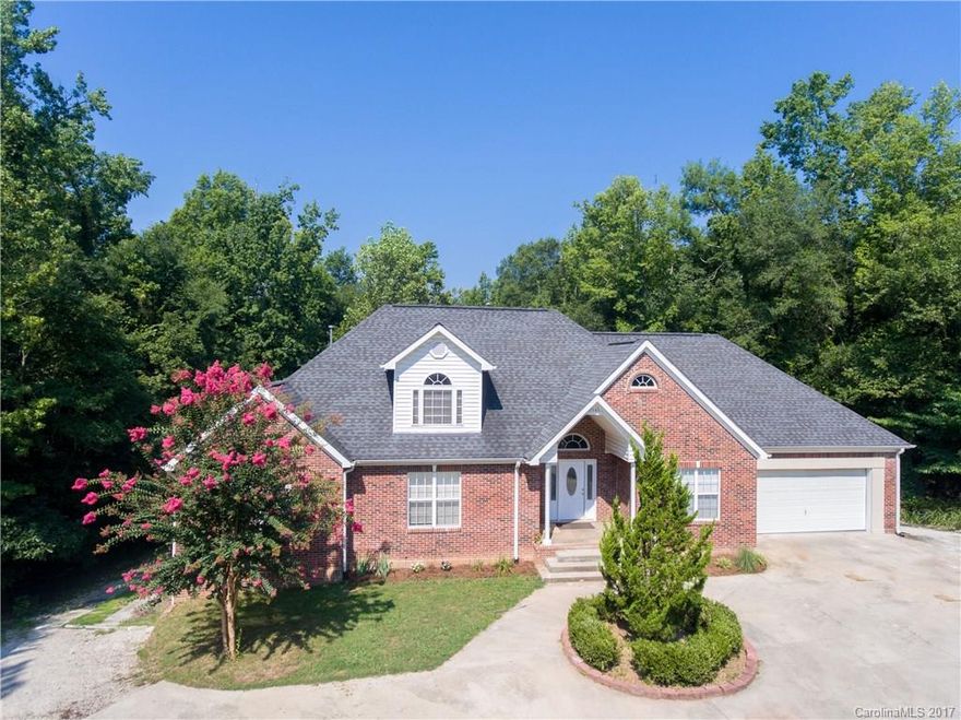 One owner all brick 1 1/2 story home with unfinished basement that could be six more additional rooms.  All this plus, attached 2 car garage and located just outside city limits on 1.7 acres with no city taxes.