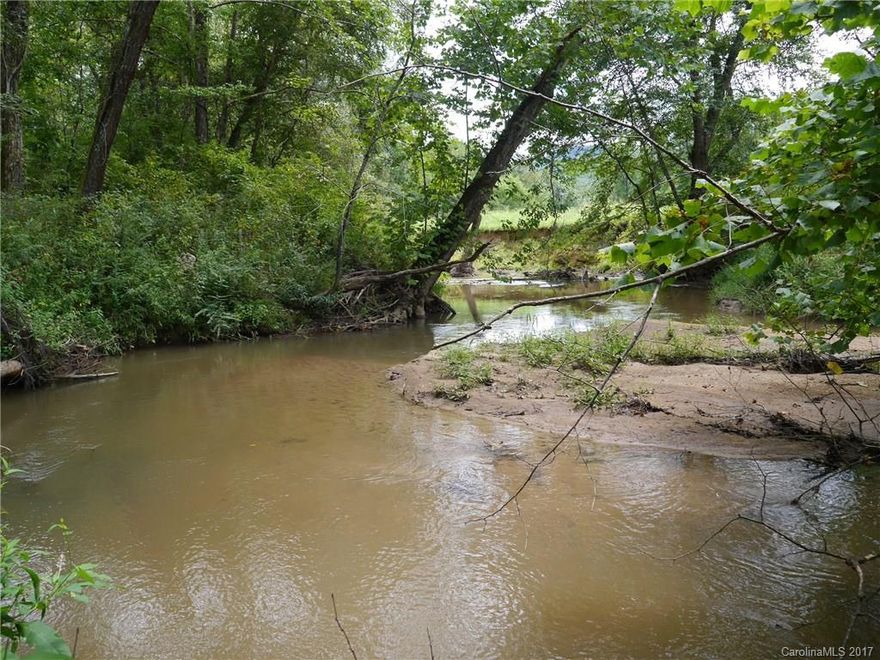 6 Acres of scenic woodland adjoining Clear Creek.