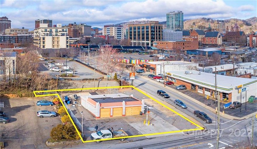 Prime location on the highly visible corner of Asheland and Hillard Avenues in the Central Business District of downtown Asheville. The property is situated along the corridor between bustling downtown and the booming South Slope district. Close proximity to a multitude of existing businesses, breweries, restaurants, hotels, etc., and adjacent to a number of new developments. Excellent vehicular and foot traffic. The building with its Art Deco-inspired details has potential to be transformed into a variety of uses with space for parking, or maximize the lot and build to suit. Bring your creative business vision to this phenomenal intersection in downtown Asheville.