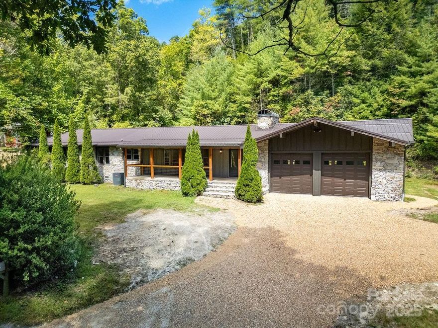 This stunning home has been extensively remodeled with attention to detail throughout. You will have everything that you need on 1 level with plenty of storage and a den in the basement. As you enter the foyer, you will love the spacious living room which as a focal point has a gorgeous stone fireplace that covers one entire wall. You will appreciate the open flow to the dining room and kitchen which offers an abundance of natural light. Off the back of the living room the sliding glass door leads to a sprawling rear deck and back yard which is very private, and it has a fire pit.  Back inside, the dining room leads to a beautiful kitchen which has custom cabinets, granite counters, and stainless appliances. There is also a breakfast nook. This level also has the primary bedroom, a 2nd bedroom which leads to a deck overlooking the creek. Wake up in the morning to the sounds of a babbling stream. There is a 3rd room which could be used as either an office or a bedroom. This level has two luxurious bathrooms with exquisite vanities and tile work. Downstairs you will enjoy a large den/recreation room which also has a full wall length stone fireplace. There are also two unfinished storage rooms in the basement. This house boasts an oversized two car garage which has a fireplace as well, and plenty of room for all of your projects. Outside you will enjoy the easy access off of Hwy. 276 (Greenville Hwy). You will have plenty of room to park you camper or RV. This level lot has room for all of your outdoor activities. The front of the house has a great covered rocking chair front porch. The back has a spacious deck that is partially covered. You can sit in the private back yard by the fire pit while you enjoy the beauty of the creek and the abundant wildlife. The side of the house also has a deck which is very close to the creek. If you are an outdoor enthusiast, the Dupont State Forest is approximately 4.4 miles, the Headwaters State Park is 6 miles, and the Pisgah National Forest is roughly 11 miles from this house. The location would make it an excellent VRBO. Enjoy living in the Cedar Mountain community with no restrictions or HOA fees and you are only about 8 miles from all of the conveniences of beautiful Downtown Brevard. This is a Must See!