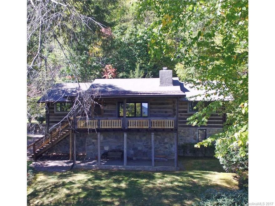 Quintessential mountain log home nestled on a beautiful, natural knoll with an exceptional view while also boasting reasonable access.  Private, gated community less than a mile from Maggie's dining and shopping, this home features 2 ensuite bedrooms on main and a third bonus room with bath on lower level.  Open kitchen with pantry and great room featuring a native stone fireplace, fabulous covered porch to drink in the view.  Huge garage with wood stove and work space complete the package.