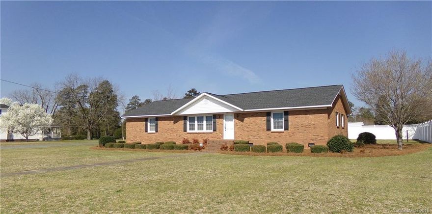 Make this immaculate, move in ready house, your home! It features an open concept living/kitchen/dining area, private master bedroom suite with den/sitting and private entrance, second master bedroom/bathroom, full hall bathroom and third bedroom.  The concrete driveway leads to a two car garage with plenty of storage/hobby space and private entrance to the master suite. The attractively landscaped corner lot affords access from Mulberry St. and features an 8' solid privacy fence. Don't miss it!