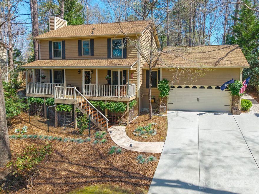 This exceptional Tega Cay home offers 4 bedrooms and 3.5 baths with plenty of thoughtful details throughout. The kitchen features SS appliances, a striking stone backsplash, and a cozy breakfast area. The great room highlights a beautiful stone fireplace, creating an inviting space. The main-level primary suite provides a private retreat with tray ceilings, a walk-in closet, and sliding doors leading to the Trex deck. Upstairs, the remaining bedrooms include a 2nd primary suite for added flexibility. The true showstopper is the gorgeous 4-seasons room that walks out to the deck, complete with its own mounted umbrella. The backyard offers a stone paver patio with timed lighting, a firepit, and an adorable, versatile storage shed. An irrigation system keeps the backyard lush year-round. Enjoy living close to Lake Wylie, Tega Cay Golf Club, and the local marina, while also benefiting from highly sought-after schools! Don't miss the opportunity to make this home yours!