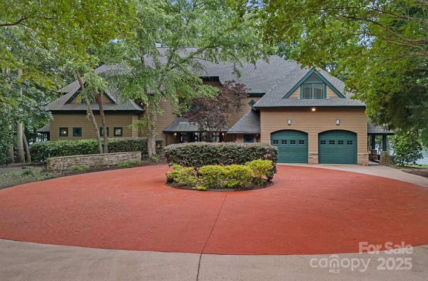 Located in the prestigious Harbour at the Pointe, this 5,500 sq ft craftsman-style custom home offers over 250 feet of stunning Lake Norman shoreline with a private dock. Situated on a prime .65 acre cul-de-sac lot, enjoy panoramic lake views with room to add a pool to create your ultimate backyard retreat. Built with all-steel construction, this 4 bed, 4.5 bath residence features soaring 19-foot ceilings and a grand Great Room/dining area with a wall of windows that flood the space with natural light. The main level owners suite includes an en-suite bath with ample space for redesign and a private screened porch overlooking the water. Additional bedrooms are generously sized with en-suite baths, perfect for guests or family. Two large bonus room provide room for office, recreational room and more.  Recently updated with a new roof and 4 HVAC systems, this home offers a rare opportunity to reimagine a classic design in one of Mooresville’s most coveted waterfront communities.