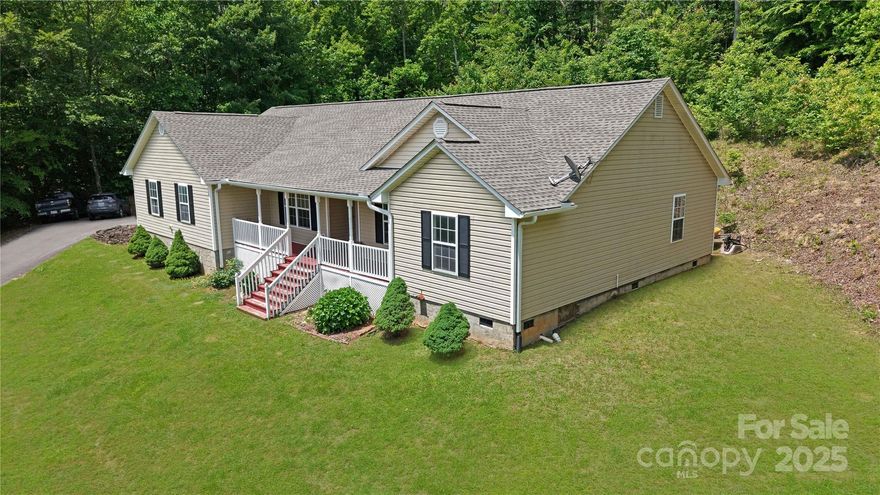 PRICE REDUCED $30,000! -- Expansive 3 Bedroom Ranch Overlooking Lake Nestled on a private .81-acre hilltop lot, this stunning 3-bedroom ranch-style home offers serene lake views and modern comforts. Located directly across from the community lake and common area, this property combines peaceful seclusion with convenient access to neighborhood amenities.  Key Features: 1 Attached garage with additional workshop area 2. Dedicated home office for remote work or study 3. Covered front porch facing the picturesque lake 4. Rear deck for private outdoor relaxation. 5.  A bright and airy great room, where the open kitchen and dining area create a welcoming heart of the home. Work from home in the dedicated office, tinker in the workshop, or unwind on the lake-facing deck with your morning coffee. This hilltop retreat offers privacy without isolation, blending modern functionality with the charm of lakeside living. Don’t miss your chance to own this ranch home in a coveted location!