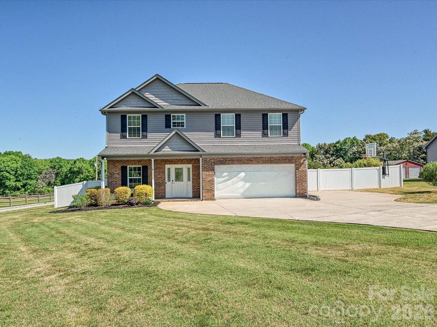 Rare Opportunity on in Union County with no HOA! Welcome to 5009 Dwight Starnes Road - this well maintained property offers the perfect blend of rural charm. Situated on a sprawling lot, this 4 bed, 2.5 bath home feels fresh and modern. The main level flows seamlessly with an open floor plan perfect for entertaining or everyday living. Upstairs boasts four generous bedrooms and the laundry room. The true highlight of this property is the massive, fully-fenced backyard—a versatile space designed for both relaxation and recreation. Pass through the sliding doors and you’re in your own private oasis. Whether you’re hosting on the lovely deck or hanging out by the fire pit, there’s so much room to breathe and enjoy the natural surroundings.