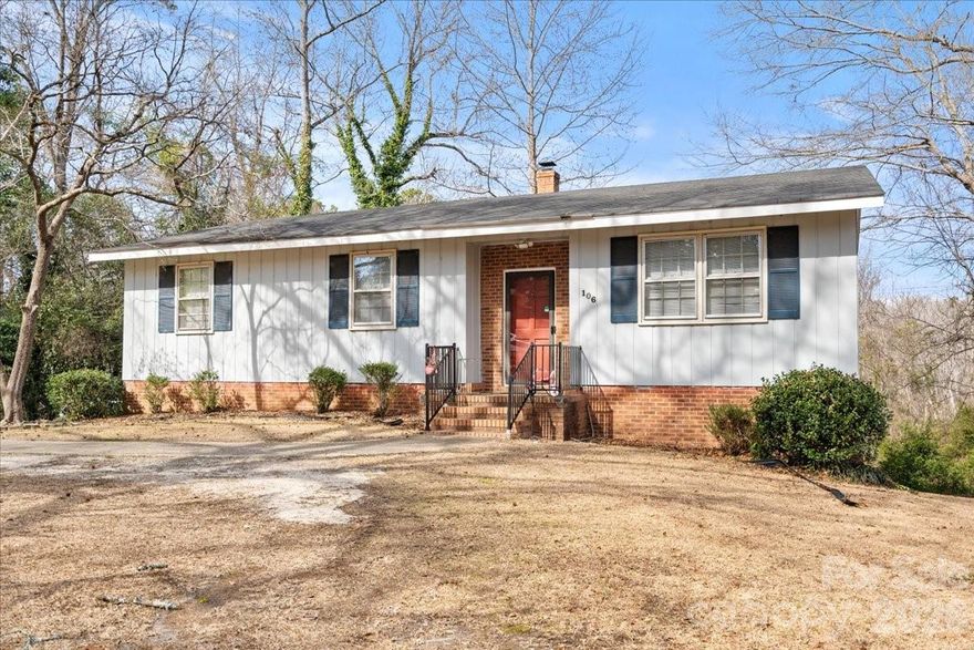 Though the beautiful view from the back deck makes you feel like you are in the mountains, this 3 BR/1.5 BA sits on an approximate half acre lot, desirable neighborhood inside the city limits of Cheraw. Well-maintained throughout, this home has an updated kitchen and primary bathroom, hardwood flooring in the dining area, a young roof and exterior paint. The kitchen features beautiful, granite counter tops andstainless-steel appliances which convey. There is a spacious basement (approx. 840 sq. ft) with fireplace, half bath, laundry, and attached, two car garage. Central air for cooling and gas pack for heat. There is additional storage outside, including attached storage and a nice building which will also convey. Make an appointment to see this one today!