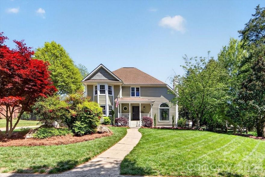 Welcome home to this magnificently updated home in popular Carmel Valley neighborhood. Every main level living surface area has been updated to create a modern space with thoughtful finishes and a layout that allows for an easy flow room to room. Enter via a covered front porch with a foyer that offers views to the rear of the home. A sunken living room to your right gives mid-century vibes with a focal centerpiece stone fireplace with wood mantle. An adjacent dining area provides ample space for your large dining table and offers a bar area with beverage fridge and storage. A large barn door separates the living/dining areas from the kitchen if needed. A modern kitchen features white cabinets, neutral granite counters and a tile backsplash. Enjoy cooking on a gas stovetop with stainless steel appliances throughout. A cozy breakfast area and bar seating in the center island gives you further options for dining and gathering. An adjacent den with half bath finishes off the main living areas. The spacious primary suite includes a large ensuite that features a free standing soaking tub with a tile surround walk-in shower, a dual sink vanity and walk-in closet with custom shelving. Head upstairs to find three bedrooms which share a unique Jack-n-Jill bathroom with dual vanities and a private tub/shower area. You'll find new carpet in two bedrooms and lvp flooring in one. Entertain outdoors on a large deck that steps down onto a travertine patio overlooking a lush green fenced yard with multiple trees and even a chicken coop. Enjoy storage in a climate controlled detached two-car garage with plenty of additional parking in the driveway. Carmel Valley offers a vibrant community feel with close proximity to Carmel Country Club just across the street along with easy access to all the amenities of South Charlotte including SouthPark, Ballantyne and more. Zone for highly rated schools.