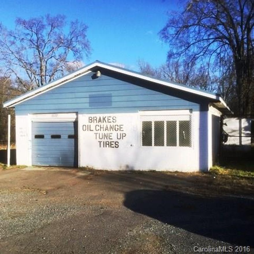 Conveniently located building with fenced area that would be good for automobile garage or tire center. Building was rented until few months ago. It needs some repair and is being sold "As-IS". Large fenced area beside and behind the building.