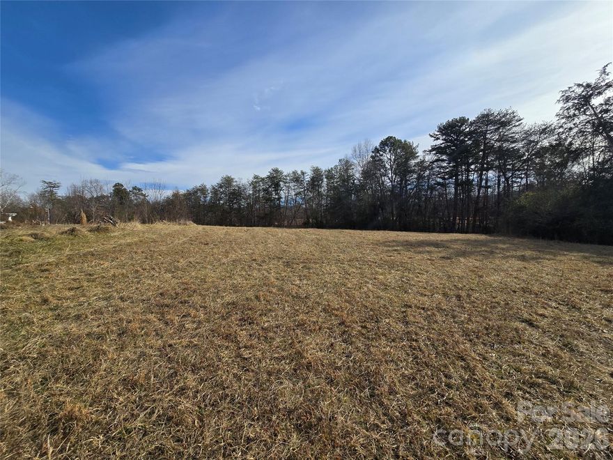 Situated just outside the Town of Valdese and zoned Burke County, this 5.3-acre tract checks all the boxes.

Location: Feels rural, with only two other homes on the street, yet you’re right in the middle of everything.

Flexibility: Build your dream home, create a family estate, or explore subdivision potential (with county approval).

Green Space: Multiple cleared building sites, formerly used for hay, create a beautiful rolling meadow setting and you’re just a short stroll to the Valdese Children’s Park with picnic shelter, playground, and lighted sports field.  Micol Creek meanders along the northern property line, adding a natural touch to this versatile tract. 

Utilities to be verified by buyer.