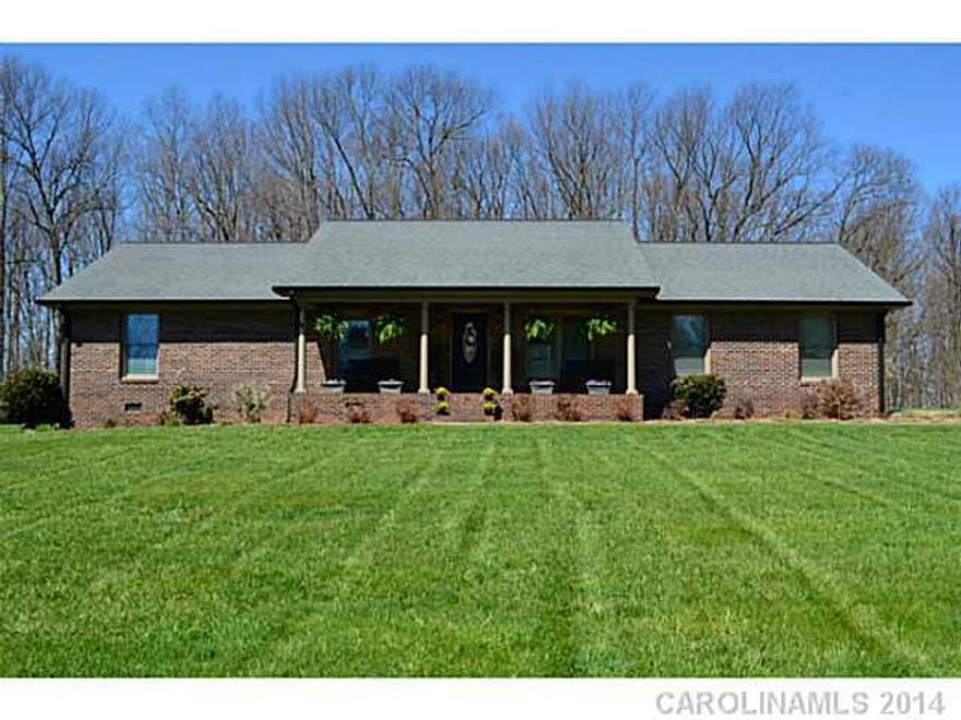 Nestled in a private wooded lot, this Picture Perfect Brick Ranch is sure to please!  You will live happily ever after in this Immaculate home boasting 3 bedrooms, Easy flow floorplan, glistening wood floors, Kitchen w/breakfast bar,  Living Room w/gas log fireplace, tile floor in baths, Rocking Chair Front Porch and Deck area. Beautiful design with a custom touch! One year Home Warranty Included!