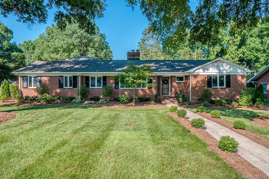 Do a Double Take. Start with the gorgeous professionally landscaped yard that is the envy of the neighborhood. That's Curb Appeal PLUS. Inside you'll love the super spacious family room with a wall of windows that fills the house with light. There is great flow between the cheery kitchen and formal living room. Perfect for entertaining- the dining room features a cozy fireplace and opens to the backyard. Relax on your screen porch or brick paver patio overlooking the backyard with carport that doubles as a party cabana. This L-shaped split bedroom plan is perfect for extended or blended family, teens or even a separate work zone. Two bedrooms and two baths on one side and huge master and fourth bedroom on the other, offers lots of privacy as needed. Tons of storage with multiple deep + walk in closets.Lots of love has gone into this meticulously maintained home.So much square footage, so much value.