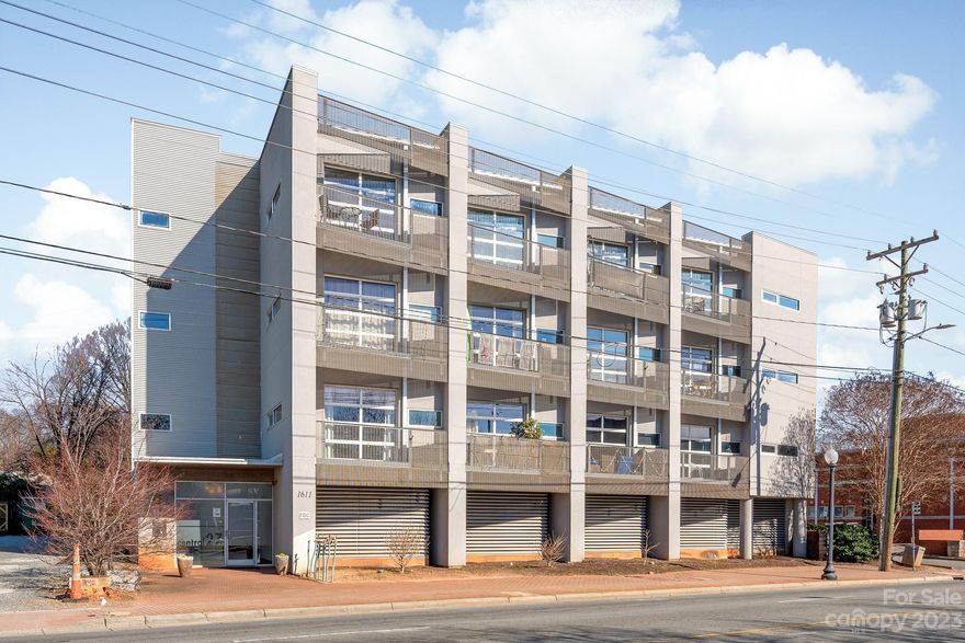 Gorgeous, renovated, FULLY FURNISHED unit in a modern mid-rise condo building located in the heart of Plaza Midwood!  Updated kitchen features quartz countertops, newer cabinetry, and industrial chic accents throughout.  Sleek glass garage door functions as spectacular focal point for entertaining, allowing natural light throughout the day and opening up to a private balcony for entertaining and enjoying Charlotte's beautiful weather.  High ceilings and open floorplan create a wonderful living space facing the quiet side of the building, yet mere steps from all the excitement of Central Ave.  Investors welcome --- only restriction is that leases are >7 days.  Walkable to the hottest shops and trendiest restaurants, as well as the spectacular Commonwealth project currently underway!  Minutes to Uptown.
