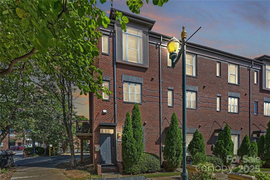 Experience the best of South End living — walk to some of Charlotte’s most loved local spots, including Suffolk Punch, Superica, Barcelona Wine Bar, Brewers at 4001 Yancey, Atherton Mill, Jeni’s Ice Cream, and more. With countless restaurants, breweries, boutiques, fitness studios, and entertainment options just steps away, this all-brick end-unit townhome offers the ultimate in urban convenience and lifestyle. Sitting directly on the Bland Street Light Rail stop, providing a quick and easy Uptown commute.

This outstanding 3 Bedroom, 3.5 Bath home in South End Towns combines comfort, style, and functionality with fantastic Uptown skyline views. The open-concept main level is designed for entertaining, featuring the kitchen, dining area, living room, powder room, and two private balconies for outdoor enjoyment. New wood floors on the main level add warmth and character to the space.

The updated kitchen is a showstopper, boasting new stainless KitchenAid appliances, recessed lighting, and beautiful granite countertops. Whether you’re hosting guests or enjoying a quiet morning coffee, the layout is bright, inviting, and functional.

All full bathrooms have been thoughtfully updated with spa-inspired finishes and stylish modern details, creating a luxury feel throughout. The top floor includes two spacious bedrooms, each with its own ensuite bathroom, plus a conveniently located laundry area. The entry level offers an additional bedroom with an ensuite bath—perfect for guests, a home office, or fitness space.

Additional features include an attached garage with extra storage and a low HOA fee, making this home as practical as it is beautiful. Large windows throughout fill the home with natural light and frame views of the vibrant South End streetscape and Uptown skyline.

Enjoy low-maintenance, lock-and-leave living in one of Charlotte’s most dynamic neighborhoods. Step outside your front door and experience everything South End has to offer — stroll through Atherton Mill, grab brunch at Roots Café, meet friends for dinner at Hawkers or Salted Melon, and spend weekends exploring local art galleries and the Rail Trail.

This is the South End lifestyle at its finest — modern living, walkable convenience, and the energy of Charlotte’s most desirable urban district all wrapped into one incredible townhome.