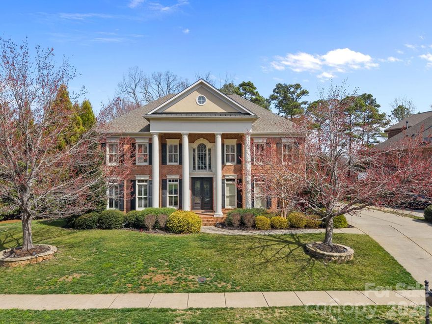 Welcome to a home where timeless architecture, thoughtful upgrades, and exceptional community amenities come together in one of Weddington’s most sought-after neighborhoods. Located in the top-rated Weddington school district, this home sits adjacent to the scenic trail entrance leading directly to Antioch Elementary School, allowing families to enjoy an easy morning walk while avoiding school traffic.
This impressive three-story John Wieland Windsor floor plan makes a striking first impression with stately pillars, a welcoming front porch, and heavy-duty double iron entry doors with operable glass panels, allowing you to greet guests and enjoy fresh air without stepping outside. Inside, 8-foot doors on the main level, plantation shutters, over 4,000 sq ft of refinished or updated flooring, and custom hand-refinished stairs and railings highlight the home’s craftsmanship.
The chef-inspired kitchen features premium Bosch appliances, an expansive island, abundant cabinetry, and a bright breakfast area overlooking the private backyard. A secondary kitchen workspace in the garage with cabinetry, countertops, and refrigerator water line hookup provides added convenience for cooking or entertaining.

The main level also includes a private guest suite with full bath, ideal for visitors or multigenerational living.

Upstairs, the luxurious primary suite offers plantation shutters, a spa-inspired bath, and two custom closets, along with a versatile flex room perfect for a nursery or home office. A dedicated fitness room with professional gym flooring can easily convert to an additional bedroom. Two additional bedrooms complete the level, including one with an ensuite bath.
The third floor features a professional home theater with Dolby Atmos surround sound, designed to contain sound and minimize noise to lower floors, creating the ultimate cinematic experience without disrupting the rest of the home.
Additional highlights include an encapsulated crawl space for improved energy efficiency, foundation protection, and year-round storage, along with multiple walk-in attic storage areas.
Residents enjoy resort-style amenities just steps away, including a clubhouse, lazy river, wading pool, tennis courts, covered pavilion, and scenic walking trails.