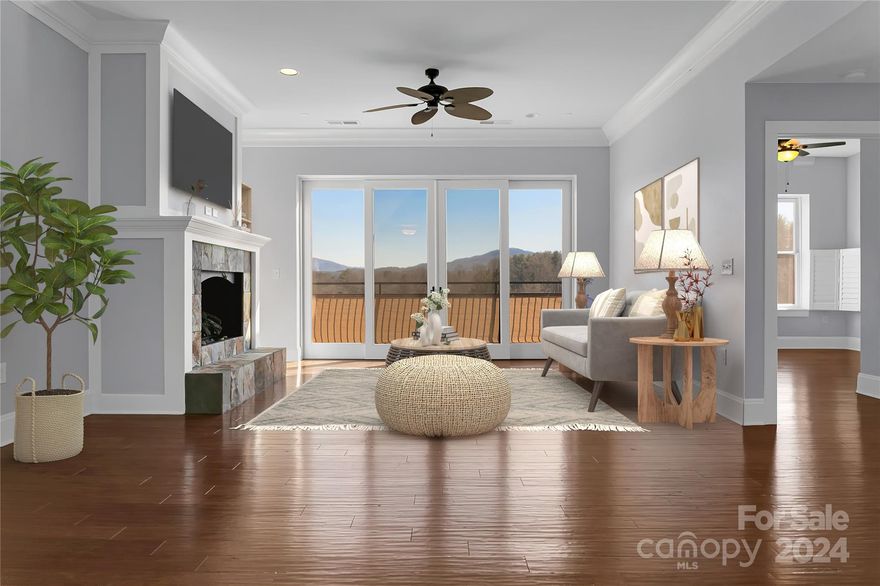 Featuring hardwood floors throughout, this move-in ready 2-bedroom, 2-bath unit is thoughtfully laid out with ample space for modern living. The natural gas fireplace offers a cozy gathering spot during winter months, and the balcony off the spacious living room is great for sipping coffee while watching the sun rise over the Blue Ridge mountains. A generous primary suite boasts a large bedroom, walk-in closet, soaking tub, double vanities and walk-in shower. Flooded with natural light and views toward Pinnacle mountain to the East, Brevard College to the North and Downtown Brevard to the South, Unit 406 is just a two-block stroll to Main Street, letting you experience in-town living that’s also just a short distance from Pisgah National Forest. In-unit laundry, covered parking, same-floor storage and a rooftop terrace with an area for dogs make it a delight to live here full-time or to enjoy as a second home.