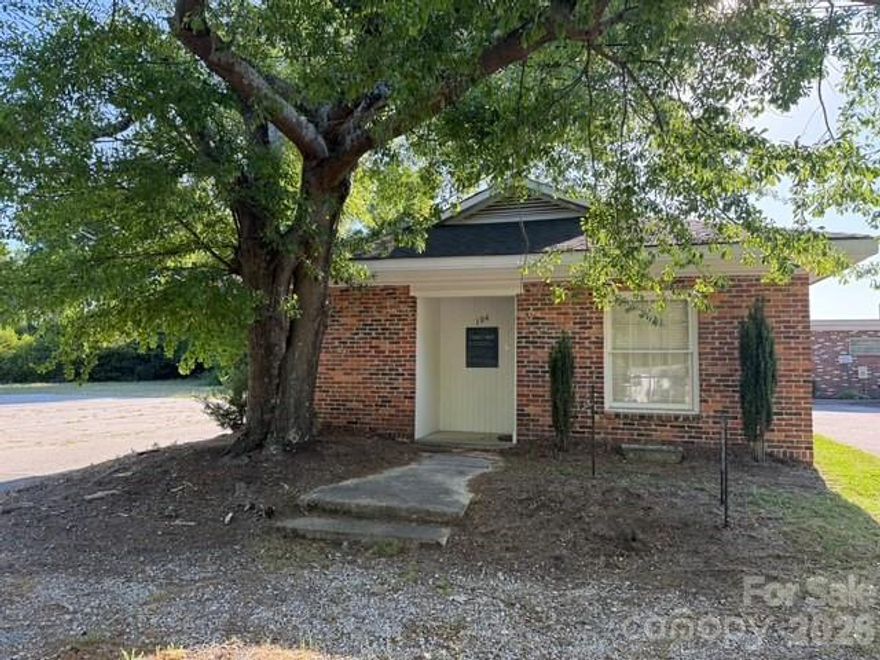 This 1100+ sq ft building, previously a dental office, sits on a 1.76 acre lot (2 lot parcel).  It has electric heat/air, within town limits, & in a doctor care area.  This property is 'easy walking' within city limits.  It could possibly be any type of office needed.  Another POSSIBILITY:  Property being REZONED to residential & being remodeled for a home....Just a thought!