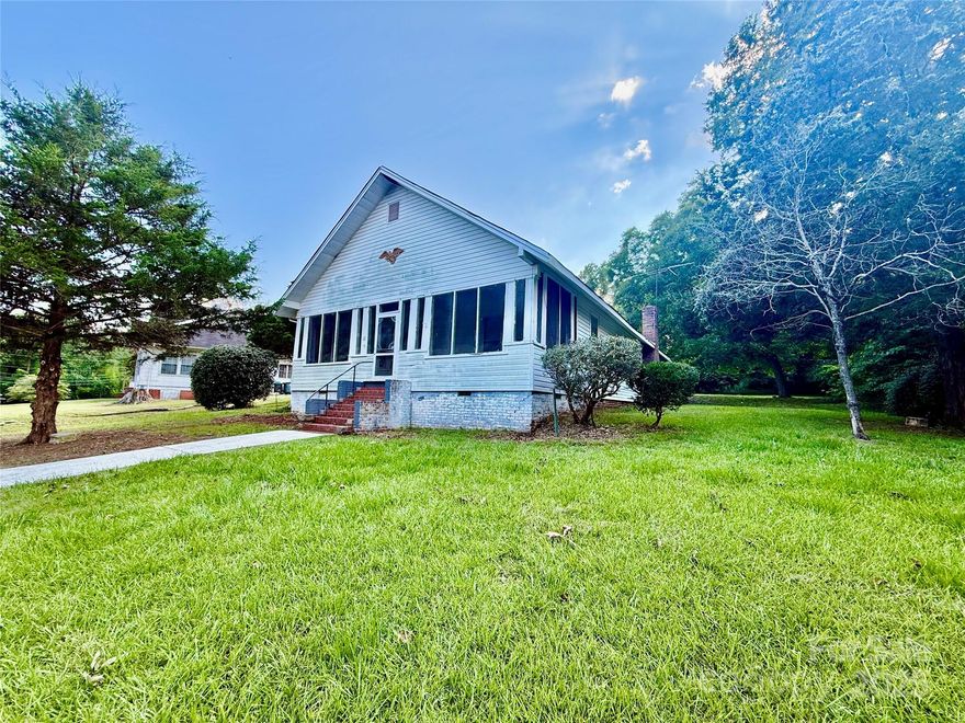 Are you looking for that diamond in the rough that you can transform into a true show piece? Look no further! Amazing potential in this 100 year old beauty originally built by the JP Stevens company for a supervisor. Soaring high ceilings and gorgeous hardwood floors serve as your starting point as you transform this stunning home. It has a new HVAC system. You'll love the large screened porch complete with swing. There is a carport in the back. Great Falls is located just minutes from I77 making it great for commuters to Charlotte or Columbia.