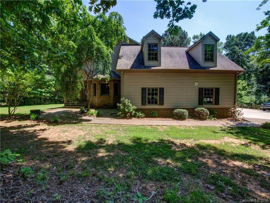 This beautiful custom home sits on a large corner lot in Summerfield. Private, fenced yard with deck and outdoor grill area makes this the perfect home for entertaining.  Open kitchen with plenty of cabinet space.  Bar area, open living room with a fireplace.  Wonderful floorplan!  All bedrooms on the main floor....Don't miss the large loft and bonus room upstairs!