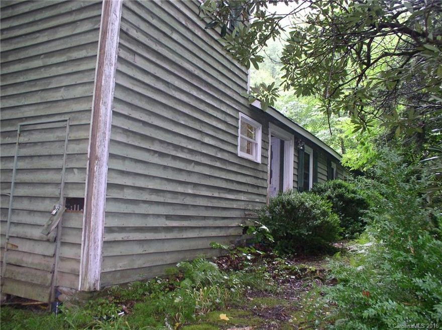 15+acres with 2 cabins, that need repairs. Surrounded on three sides by national forest. Great views of Mt. Mitchell A pristine trout stream flows through it, with South toe River in short walking distance. Miles of Hiking and Horseback trails around the property. would be great for, Preppers, camping,   Fishermen, hunters, hikers,  lodge, Church or Group Camp.  Lays great not steep . Close to Mt. Mitchell Golf course and the Blue Ridge Parkway.  Just a piece of heaven.