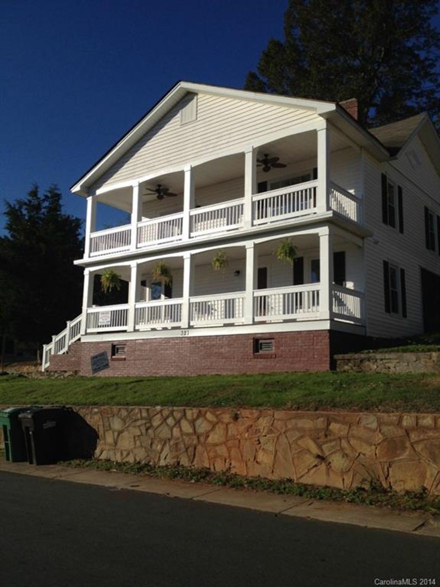 Beautiful colonial style home conveniently located close to Downtown Cramerton, shopping, and I-85. Its two large porches and historic charm make this home a very desirable and unique find! Second story balcony flows into the living area with french doors making it great for entertaining, with its breathtaking views of Cramerton. Fully remodeled-all work permitted.Updated plumbing/wiring. Master suite. New beautiful hardwoods in living areas, kitchen, master bedroom. New carpet.New Applainces