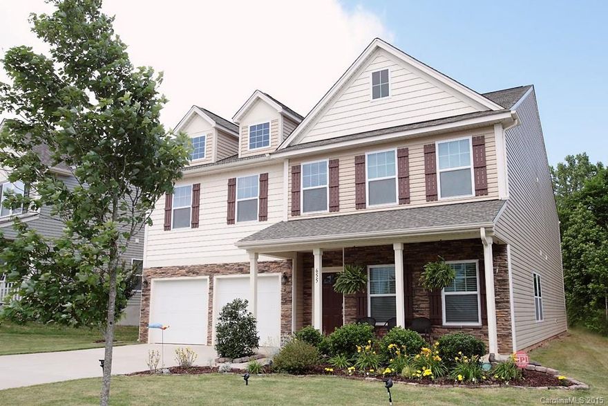 Located in one of the most desirable areas of Fort Mill, this spectacular five bedroom home is within walking distance to the community pool, playground and clubhouse. Situated on a quiet lot with full irrigation, the oversized 12x12 patio is perfect for entertaining. Gourmet kitchen ties in beautifully with hand-scraped hardwoods.  Other features include: study with French Doors, surround sound prewire in bonus, security system with glass break, camera and keypad door. Utility sink in garage.