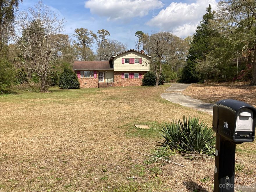 Quite neighborhood nice 2 story single family partial brick home awaiting a new owner to bring fresh new ideas to this classic. Starting with plenty of room at over 1856 SQ FT. 3 beds 2 1/2 baths. Confirmed county water, and septic-I think in front yard. 1.26 acres as per county, provides plenty of room for animals and kids to play. 2 car garage converted to a family room, can easily be reconverted. Owners have never lived in the property. Property looks to be in great shape. In the garage/family room is unknow if the bank attempted to repair something in the celling, although the sheetrock is not repaired. Nice Shed conveys. "As is" where is. Priced to sell quickly. Bank is maintaining the home and grounds and has winterized. No guarantees to condition of the house/surroundings, square footage or yard size,  or septic buyer to check all pertinent info.