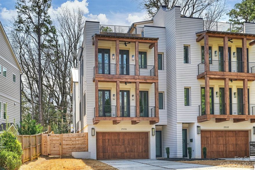 Gorgeous new construction Duet located in the heart of Elizabeth with NO HOA DUES. Large private back yard space! Sophisticated modern finishes to include white oak hardwoods, Bertazzoni Dual Fuel Range, Liebherr paneled refrigerator, and waterfall countertops. Architectural design by Craft Design Studio creates an airy feel that softens the home with natural light on all sides of the residence. If you are seeking privacy, ease, and a chic space to welcome family and friends, this residence will not disappoint. Decks off kitchen & living room, through accordion doors, make entertaining a breeze in the large outdoor spaces. To enjoy the views, elevator accesses the rooftop terrace with Ipe wood decking tiles. High end lighting, tile, and plumbing fixtures. Custom wood trim accents create warmth and depth. Large garage at completed lower level w/ drop zone. Walkable to parks, shops, and restaurants of Elizabeth and easy access to all Charlotte has to offer! Lender rate package available.