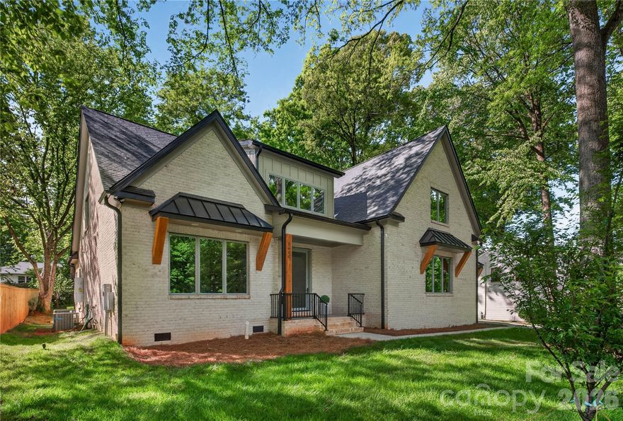 Welcome to this stunning fully brick luxury home located in one of Charlotte’s most highly desired areas, just minutes from SouthPark Mall, upscale shopping, fine dining, and premier entertainment. This beautifully designed 4-bedroom home offers luxury finishes throughout, an open-concept main living area, and an impressive two-story foyer that creates an elegant first impression.

The thoughtfully designed layout includes dual laundry rooms on both the main and upper levels for added convenience, a spacious loft complete with a dry bar and beverage cooler, plus an additional bonus room that can easily serve as a guest room, office, or flex space. The gourmet kitchen is equipped with luxury appliances and flows seamlessly into the main living and entertaining spaces.

Outside, enjoy a large driveway with abundant parking, an additional rare one car detached garage, and a backyard designed for entertaining with partial fencing and natural privacy provided by mature trees and lush landscaping. Nestled in a charming neighborhood setting with beautiful established trees throughout, this home offers the perfect blend of luxury, comfort, and convenience.